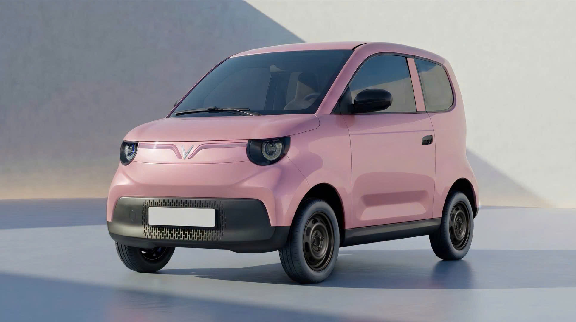 VinFast VF2 mặt trước góc hông trái màu hồng phấn — đèn pha tròn dễ thương, thiết kế mini SUV cá tính